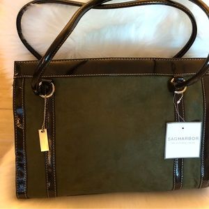Olive green suede with black/brown patent, trim. Two inside sections. 26 “ strap